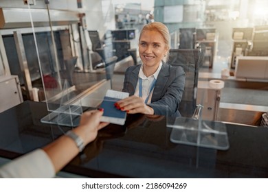 Female Giving Passport And Ticket To Staff At Airport Check In Counter