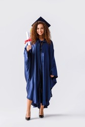 Female Graduating Student With Diploma On Light Background