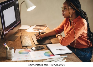 Female graphic designer working at her desk