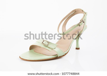 Female green leather elegant sandal on white background, isolated product, comfortable footwear.