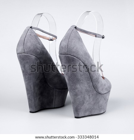 female grey shoes over white 