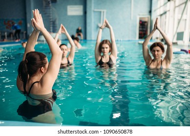 Female Group On Aqua Aerobics In Swimming Pool