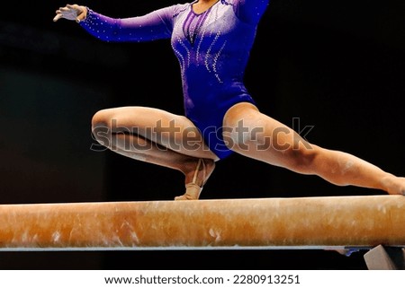 female gymnast athlete balancing on balance beam gymnastics, sports summer games 
