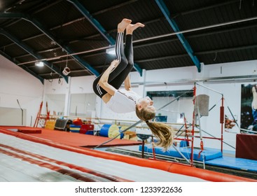 Female gymnast practicing a gymnastic - Powered by Shutterstock