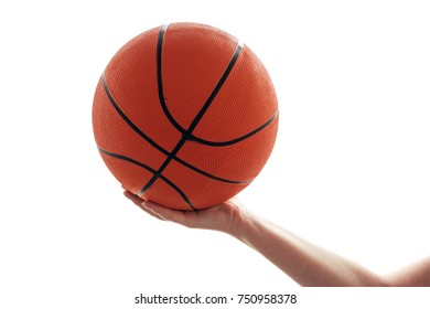 Female Hand With Basketball Isolated On White Background. Woman Holding Ball, Sport Equipment And Recreation Concept.