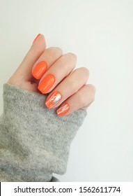 female hand beautiful orange manicure  
