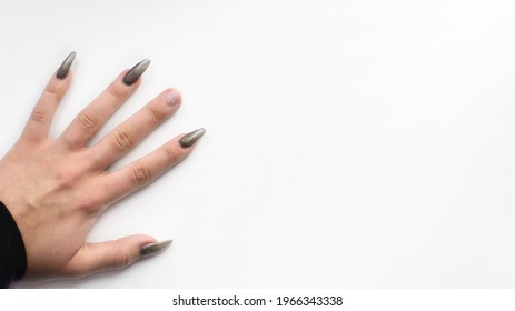 Female Hand With A Broken Nail On A White Background, Top View. Banner, Copy Space. Damaged Gel Polish. Bad Manicure