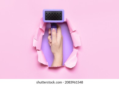 Female Hand With Brush For Pet Grooming On Color Background