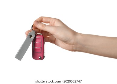 Female hand with car key and leather keychain on white background