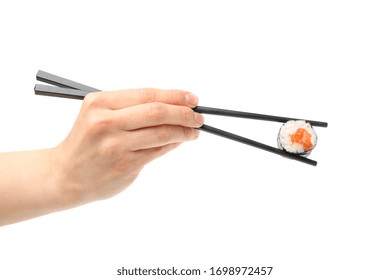 Female hand with chopsticks holds sushi roll, isolated on white background - Powered by Shutterstock