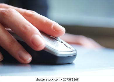 Female Hand Clicking Computer Mouse