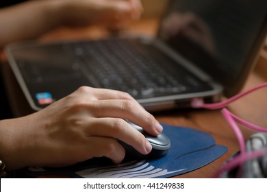 Female Hand With Computer Mouse On Table, Closeup And Vintage Effect.