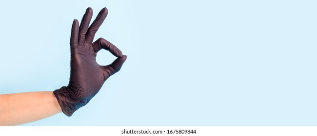 Female Hand In Cosmetology Medicine Black Glove Pointing Up Okay, Yes, Accepting Hand Sign To The Side, Studio Shot Copy Space, Banner For Your Flyer Site Everything Will Be Fine Pandemic Coronavirus