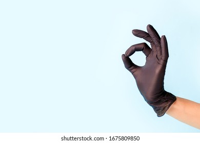 Female Hand In Cosmetology Medicine Black Glove Pointing Up Okay, Yes, Accepting Hand Sign To The Side, Studio Shot Copy Space, Banner For Your Flyer, Site Everything Will Be Fine Pandemic Coronavirus