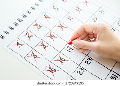 Female Hand Cross Out Days In Calendar Hand Drawn