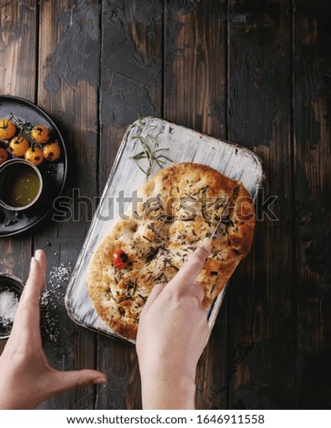 Similar – Image, Stock Photo female hands cut baked roll with poppy seeds