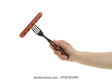 Female Hand Hold Fork With Grilled Sausage, Isolated On White Background