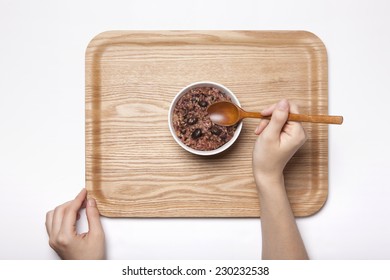 A Female Hand Hold Multi-grain Rice With Wood Spoon On The Wood Tray Isolated White, Top View At The Studio.