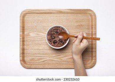 A Female Hand Hold Multi-grain Rice With Wood Spoon On The Wood Tray Isolated White, Top View At The Studio.