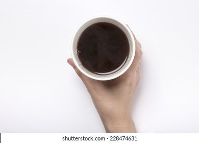 Female Hand Hold A Take Out Coffee Cup With Americano Isolated White And Top View.