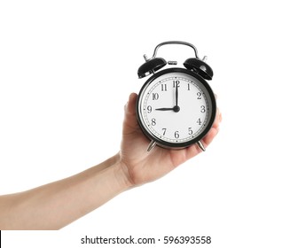 Female Hand Holding Alarm Clock On White Background