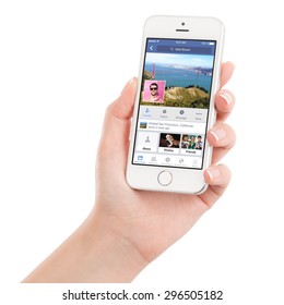 Female Hand Holding Apple Silver IPhone 5S With Facebook Application On The Screen. Facebook Is An Online Social Networking Service. Isolated On White Background. Varna, Bulgaria - February 02, 2015.