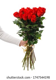 Female Hand Holding A Beautiful Bouquet Of Bright Red Roses With A Long Stem Isolated On A White Background. Celebration Concept.