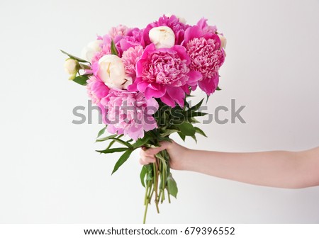 Similar – Image, Stock Photo Hand holding white peony,  minimalist grey background