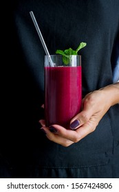 Female Hand Holding A Beet Smoothie.