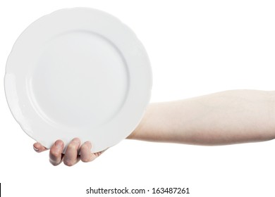 Female Hand Holding Big White Plate Isolated On White Background