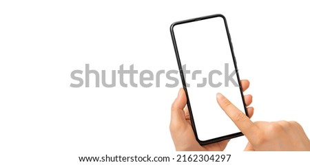 Female hand holding black cell phone smartphone with blank white screen and modern design isolated on white background. Mockup phone. Woman's Hand Holding Smartphone With Blank Screen, mockup phone
