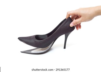 Female Hand Holding Broken High Heel Shoes