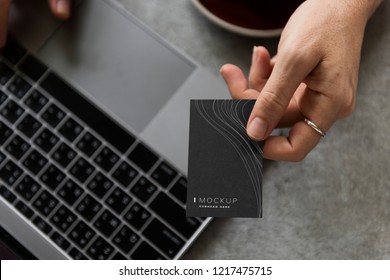 Female hand holding a business card mockup