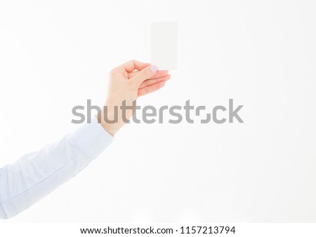female hand holding business card isolated on white background. Copy space