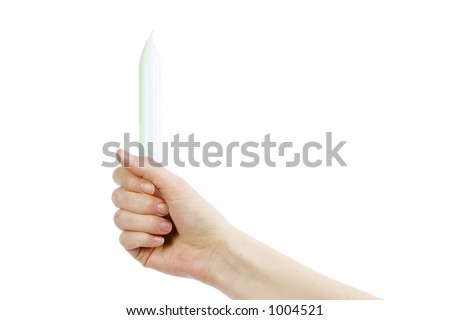 A female hand holding a candle with a grip fist.  Isolated on white with clip mask.