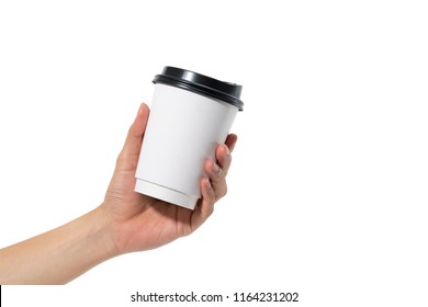 female hand holding a coffee paper cup isolated on white background.