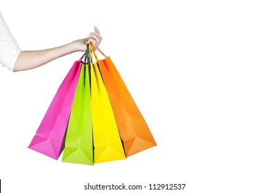 Female Hand Holding Colorful Shopping Bags