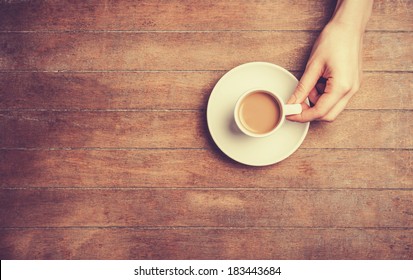 Female Hand Holding Cup Of Coffee.