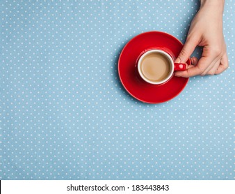 Female Hand Holding Cup Of Coffee.