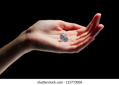 Female hand holding diamond