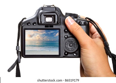 Female Hand Holding DSLR Camera Isolated On White