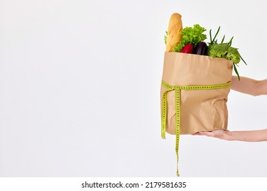 Female Hand Holding Eco Paper Bag With Groceries