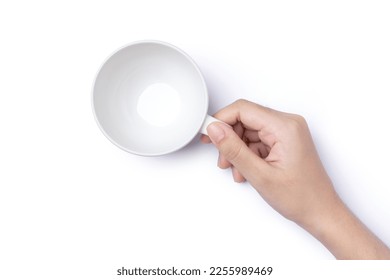 Female hand holding empty coffee cup isolated on white background with clipping path, top view, flat lay.