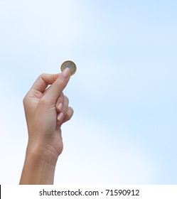 Female Hand Holding An Euro Coin