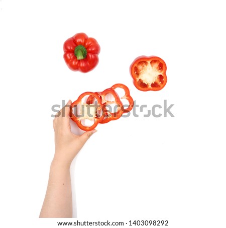 
Female hand holding Fresh juicy peppers on a white background  