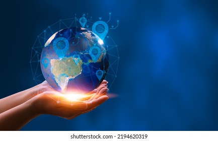 Female hand holding a globe connected to a GPS symbol with global network connection. big data analytics and smart business ideas global business ideas future digital link technology