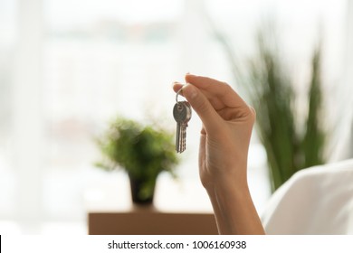 Female Hand Holding House Key, Customer Buying Real Estate, Woman Buyer Becoming New First Time Home Owner, Rental Property Purchase, Mortgage Investment Loan, Ownership Concept, Close Up View