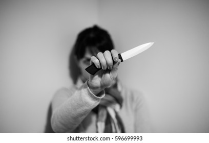 Female hand holding a knife 