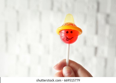 Female Hand Holding Lollipop Condom On Stock Photo 669515779 | Shutterstock