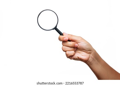 A female hand holding a magnifying glass isolated on a white background. Mockup with empty copy space for a text and design - Shutterstock ID 2216553787